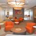 wall art in an orange seating area