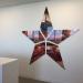 Large Reflective Star Hung on a Wall
