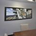 panoramic framed artwork hanging above meeting table