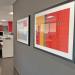 two framed artworks hang in hallway