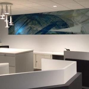 Large semi-reflective artwork on wall