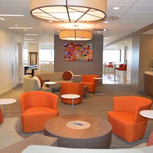 wall art in an orange seating area
