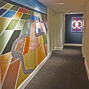 Large photo with writing in a hallway