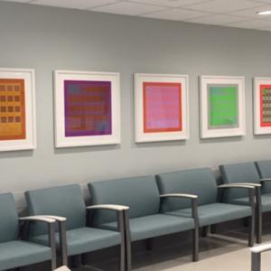 Line of chair with line of paintings